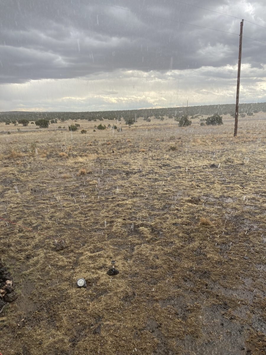 Rain falling over the open Concho grassland